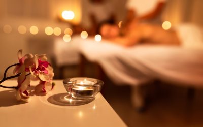 Spa Composition With Aromatic Candle And Exotic Orchid Flowers. Unrecognizable Couple Receiving Relaxing Massage At Spa. Beauty, Wellness And Relaxation. Selective Focus, Panorama With Copy Space