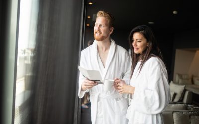 Beautiful happy young couple enjoying wellness spa resort treatments